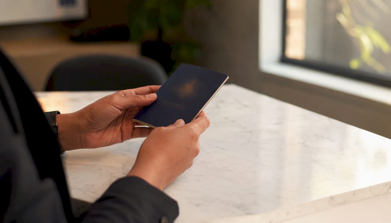 Hands holding blurred Australian passport