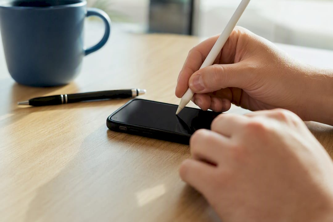 Hands filling Form 80 on tablet