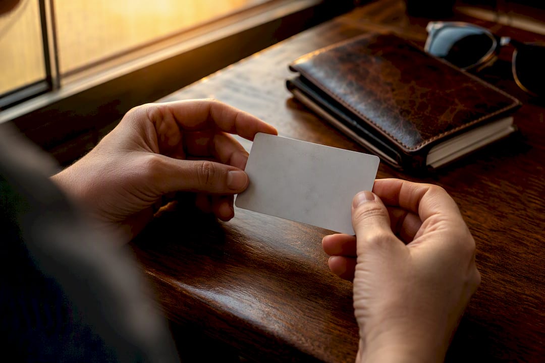 Hands holding generic travel insurance card