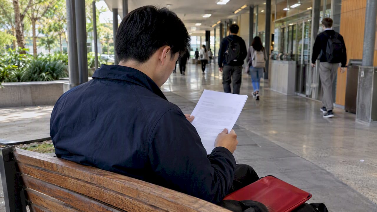 Student reviewing a visa grant notice